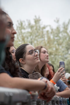 Fans of Ella Jane stand against the barricade as they watch her perform. Jane was one of the three performers University Union invited to perform at Block Darty. 
