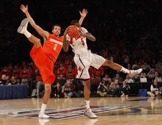 Louisville's Kevin Ware (#5) intercepts a pass to Michael Carter-Williams. 