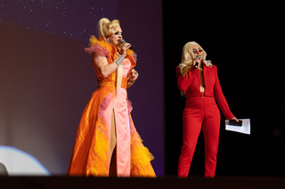 Hosts of the night of 20th Annual Drag Show Finals—Pandora Boxx (left) and Kylie Sonique Love—announce the contestants. 