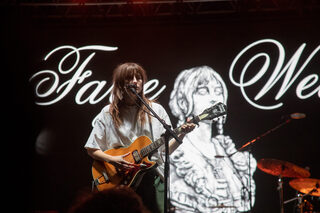 Faye Webster performs some of her most popular songs with her name and an artistic self-portrait displayed behind her. As the show went on, she became more conversational with the audience and took a fan’s BeReal.

