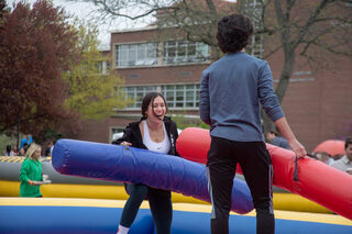 Students battle each other with giant inflatable battering rams in the middle of the Quad. UU organized the day’s festivities, including a bounce house and other inflatable games.